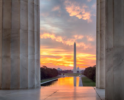 Washington Monument overlooking the National Reflecting Pool at sunset