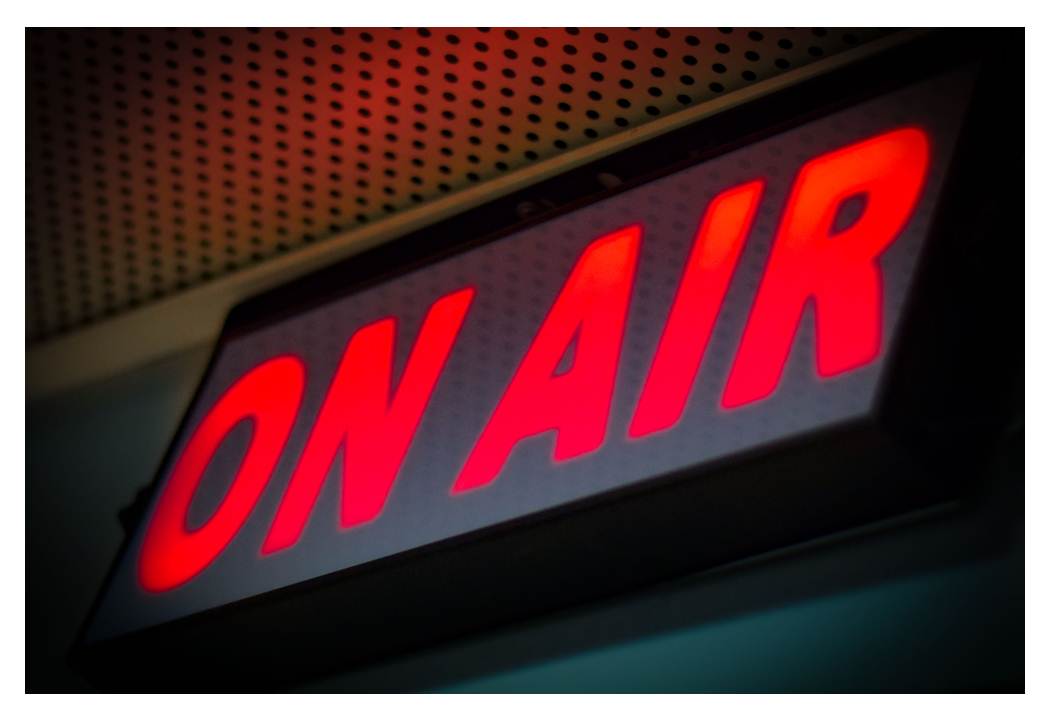 Glowing "ON AIR" sign for live webinars