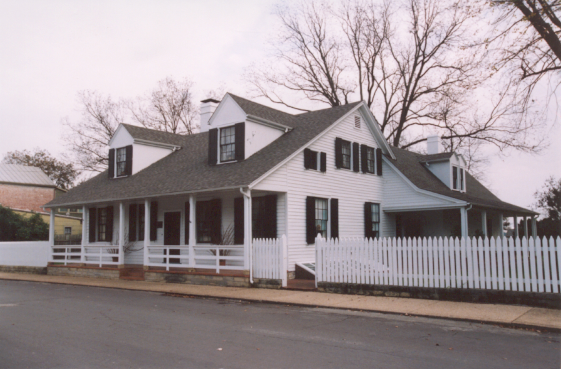 Beauvais Linden House, Exterior Front view of the house showing the new roof and gutters, historically accurate chimney caps, repaired/reproduced shutters, and new coats of paint. Credit: Bolduc Historic Properties