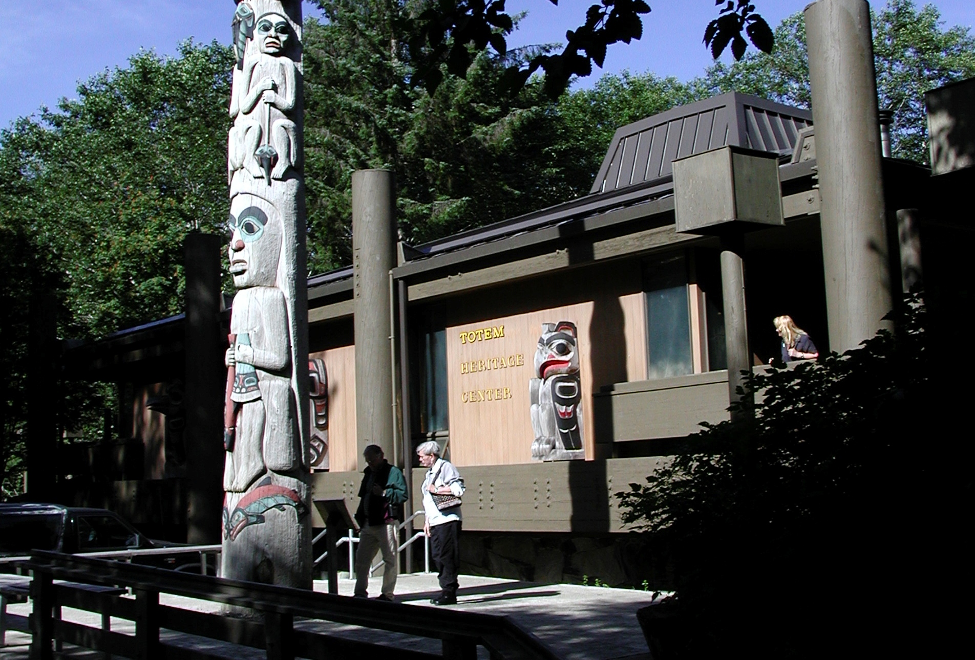 A Fog Woman totem pole in front of Ketchikan's Totem Heritage Center