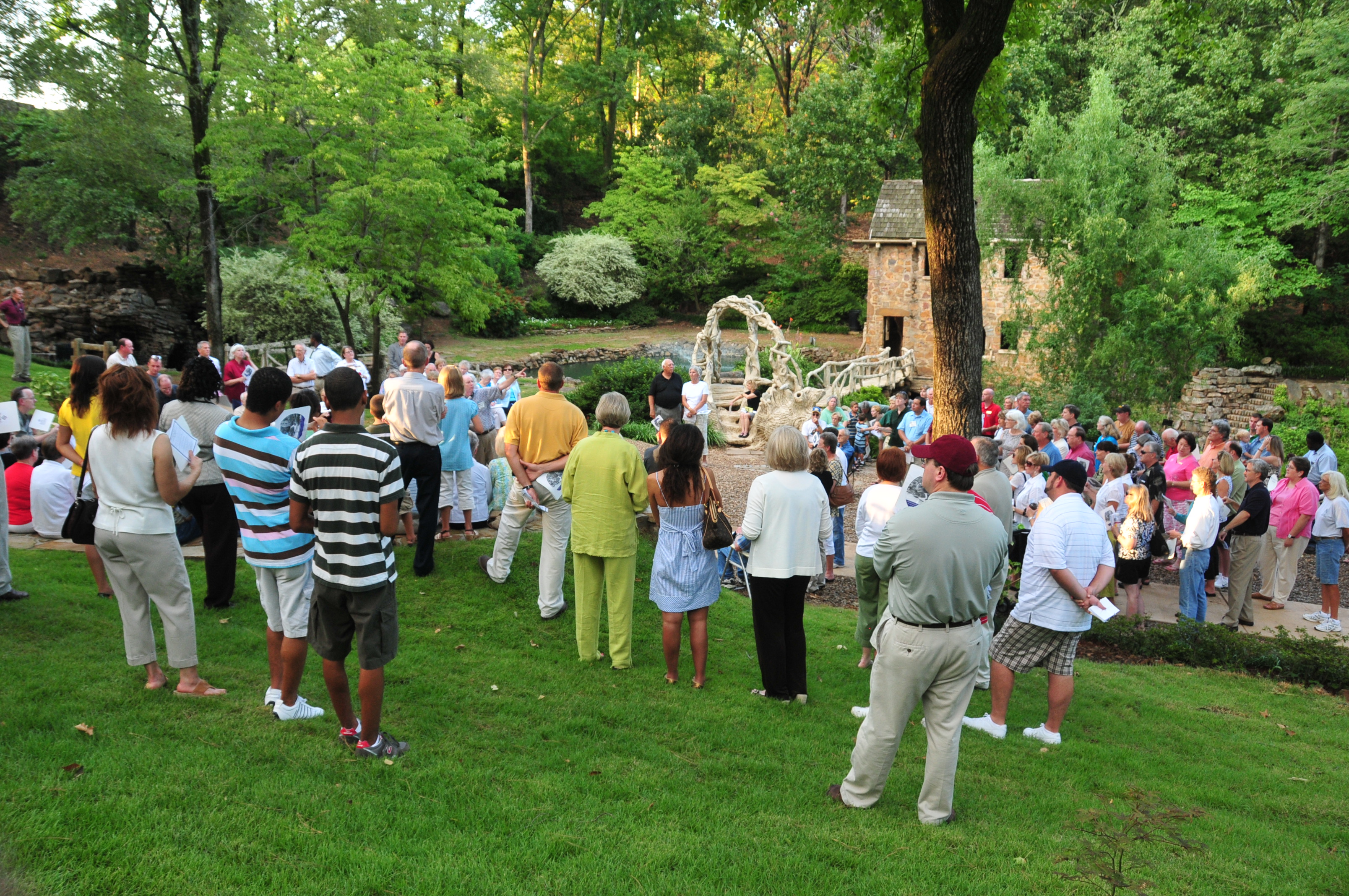 Guests celebrate the rededication of the Old Mill in T.R. Pugh Memorial Park in North Little Rock