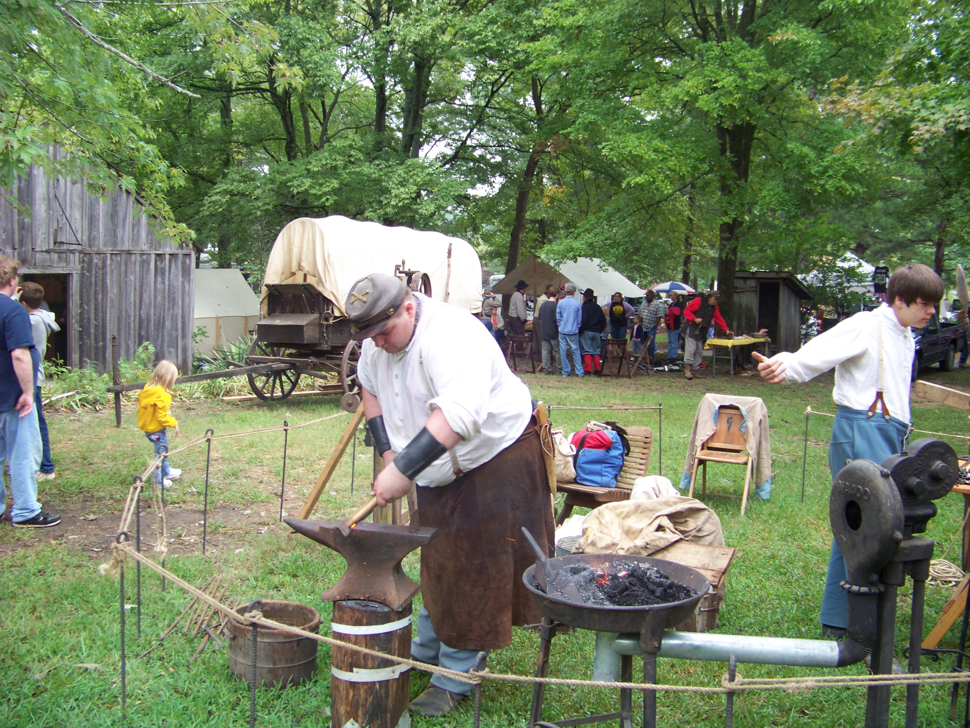 Visitors enjoy a demonstration of blacksmithing skills during Randolph County Pioneer Days.