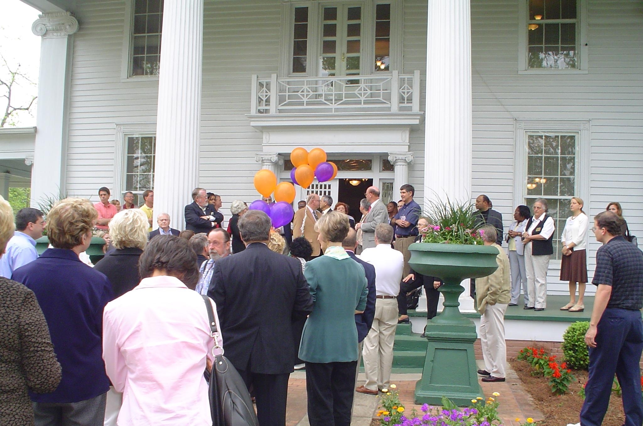 Bus tour participants gather outside the historic Troutman House (circa 1870) in preparation for a walking tour of downtown Fort Valley, Georgia.