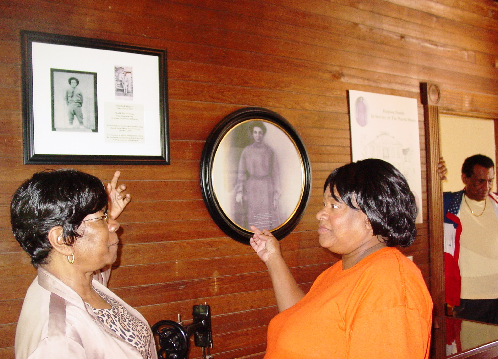 Visitors examine portraits and artifacts in the1836 Marsh-Warthen House in Walker County, Georgia. The County purchased the house and, working with the Walker County Historical Society and the Marsh House Community Task Force, made repairs to stabilize and protect the house.