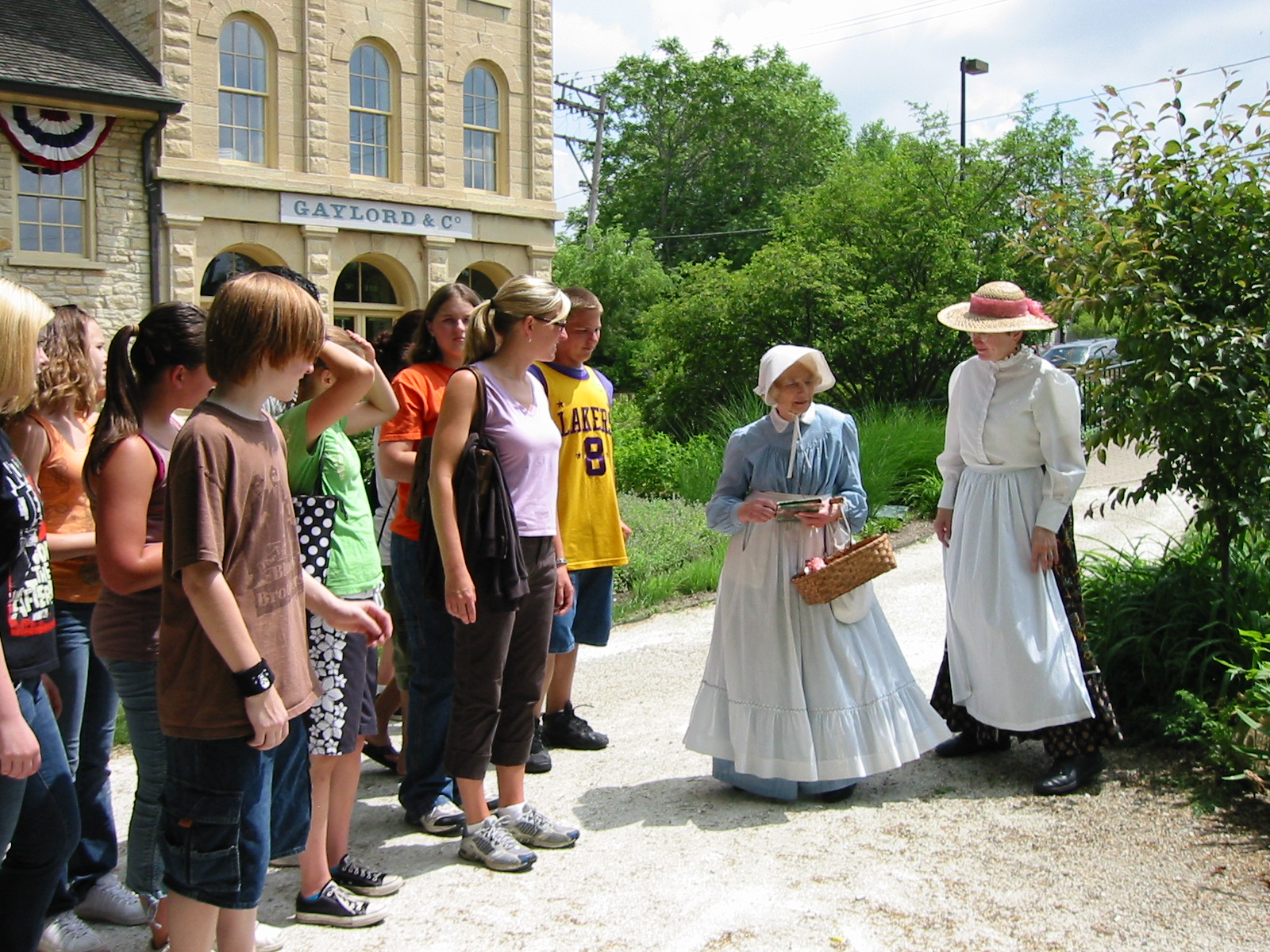 Costumed interpreters lead a school tour at the Gaylord Building in Lockport, Illinois. This 1838 canal warehouse is one of the oldest buildings in northeastern Illinois.