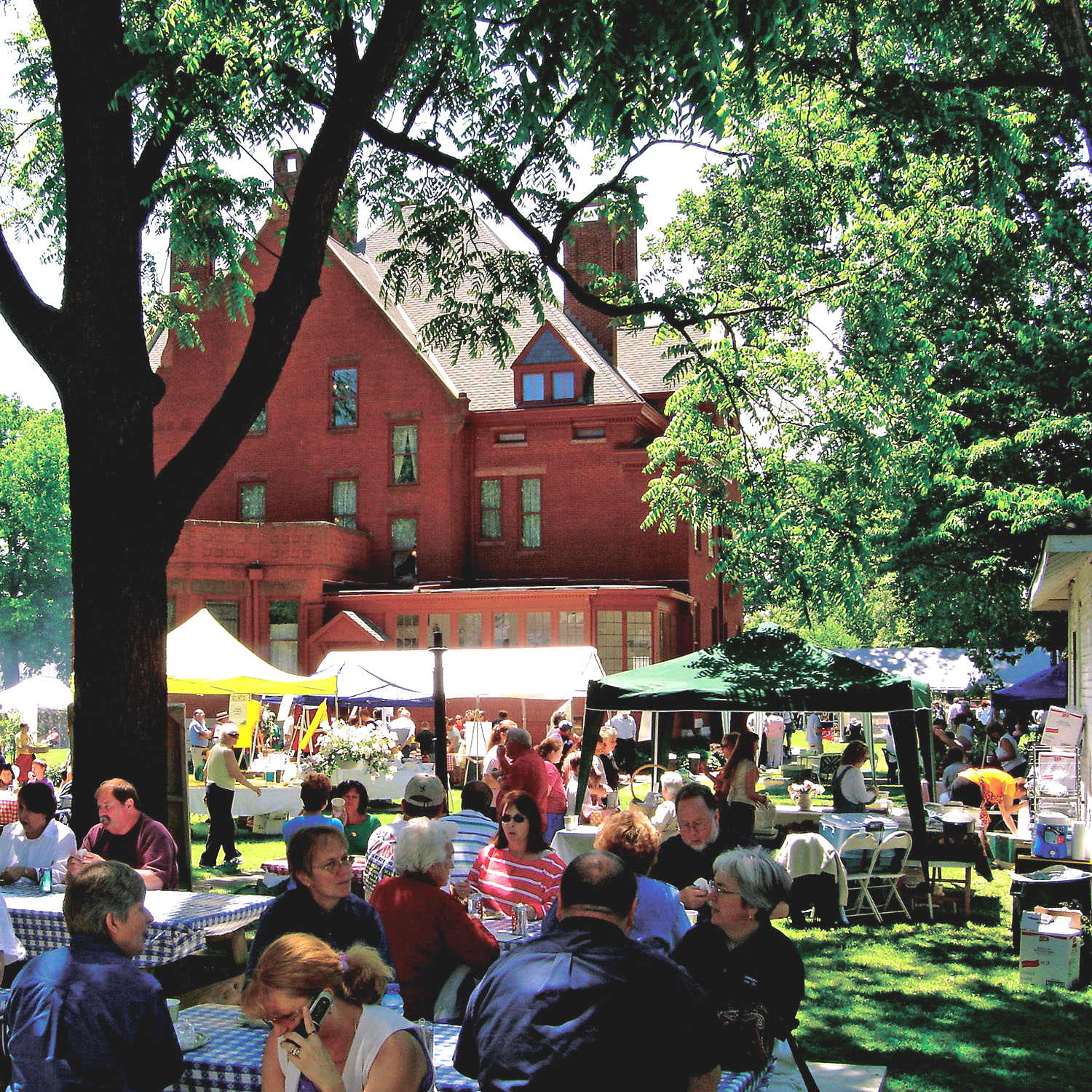Participants enjoy an outdoor celebration at the Howard Steamboat Museum, one of several in Jeffersonville, Indiana. The mansion was built in 1890 by a shipyard magnate and is listed on the National Register of Historic Places.