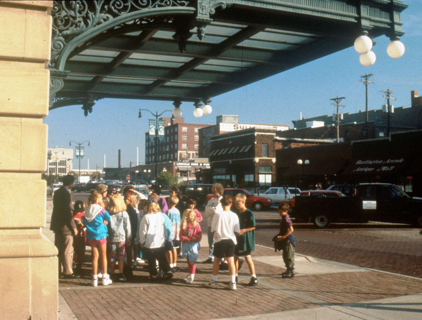 A group of children tour Lincoln, Nebraska's Haymarket Landmark District, which features 19th and early 20th century wholesale houses