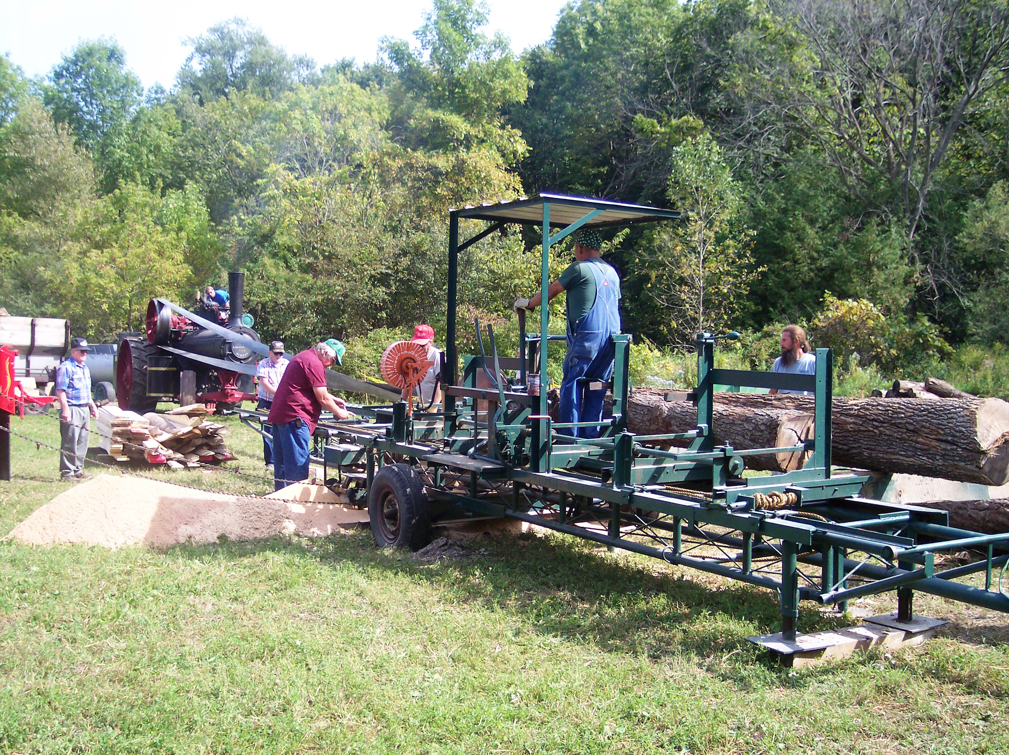 Members of the Richfield Historical Society cut logs during a working demonstration at the Richfield Thresheree.