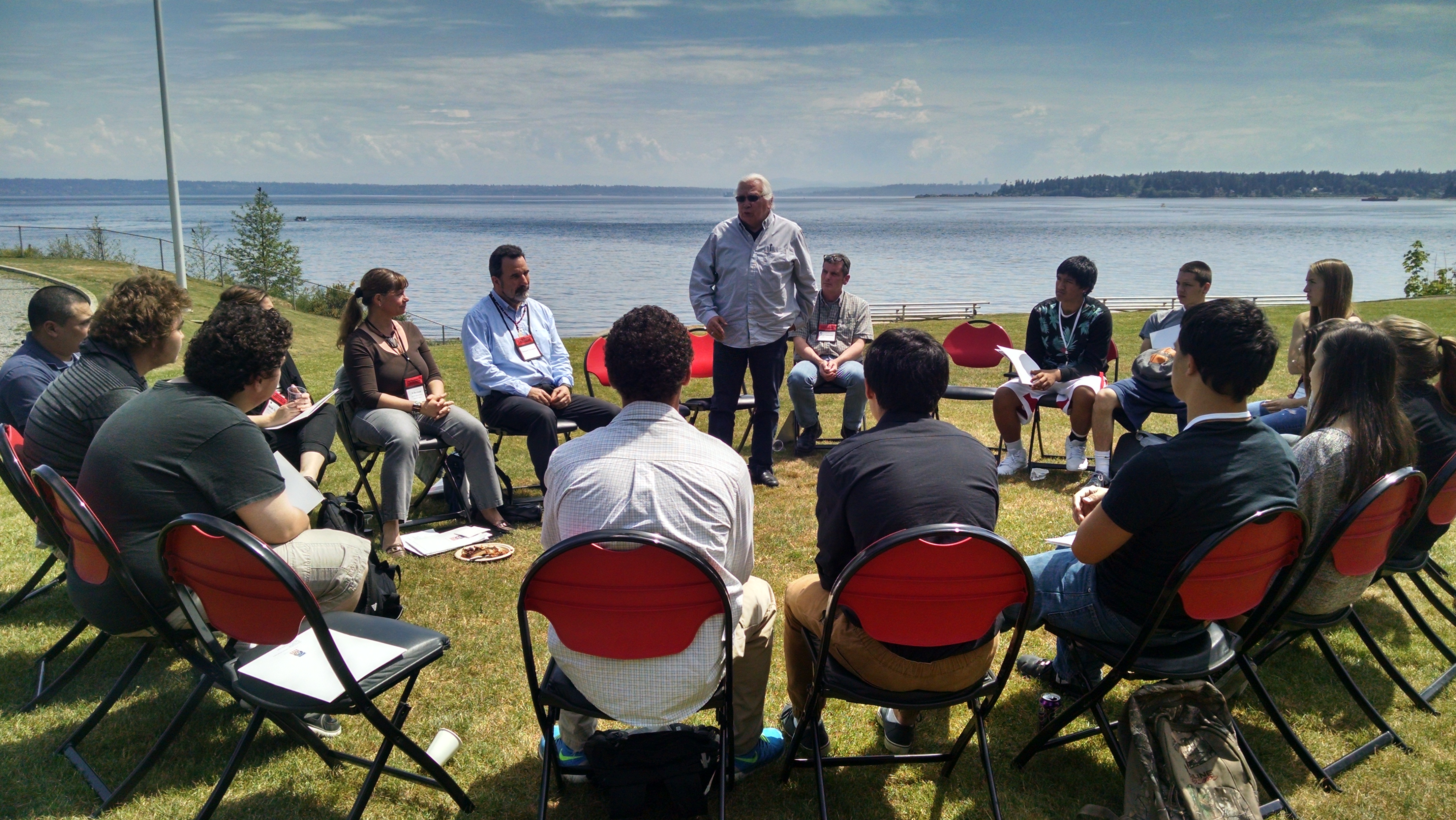 group of people sitting in a round table discussion