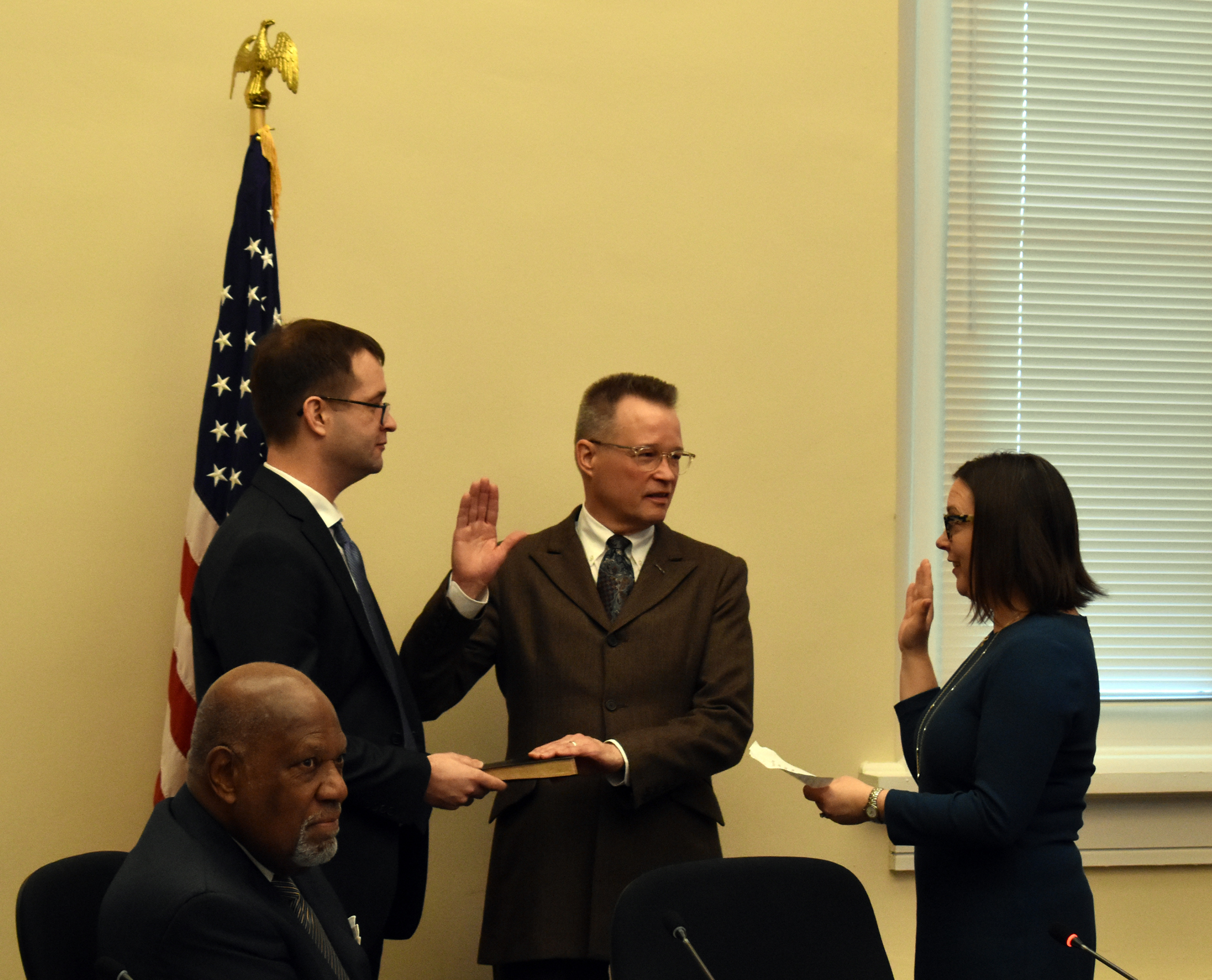 Jay Vogt with his son Gabriel being sworn in by Chairman Jorjani