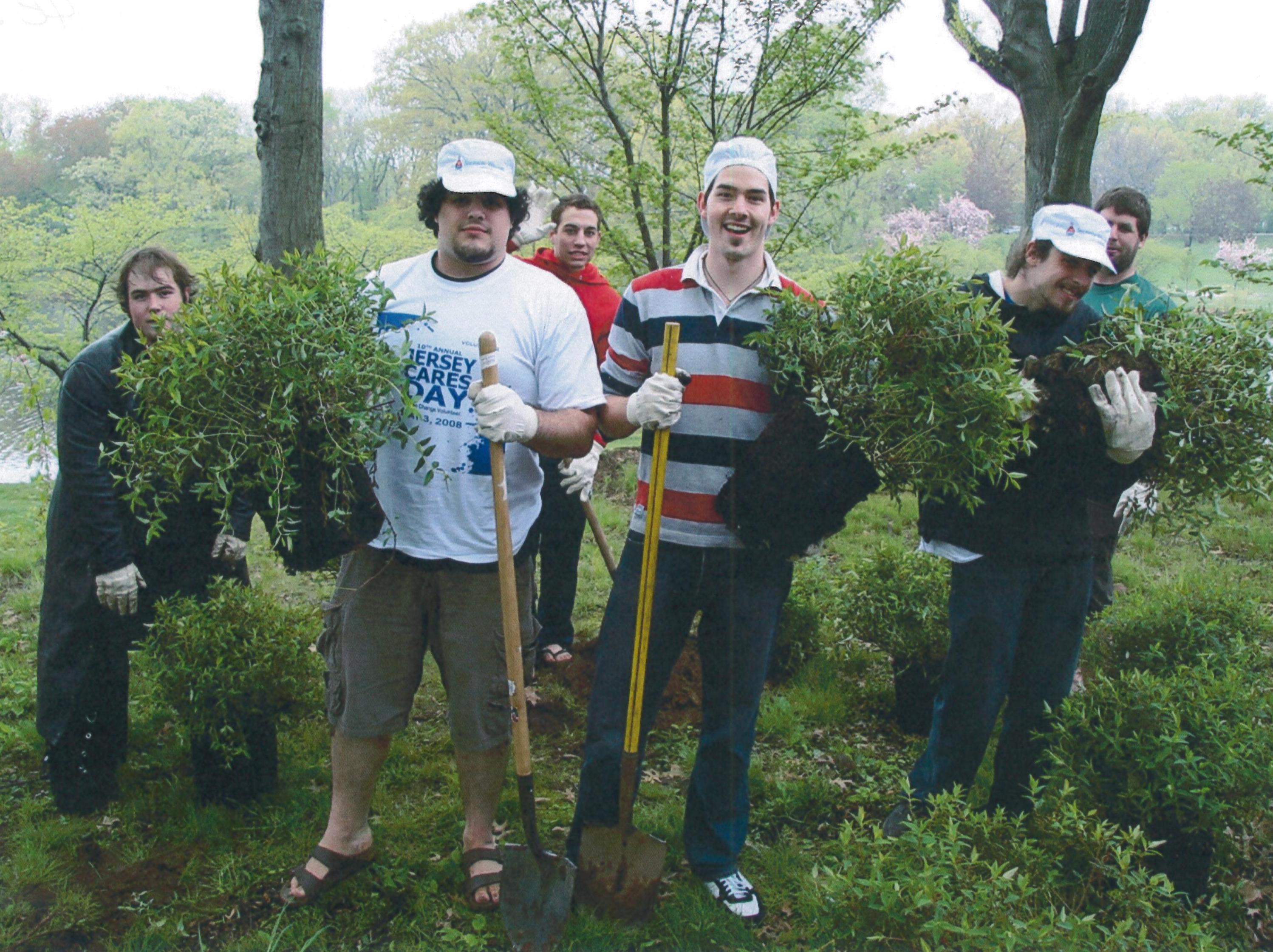 Volunteers planting shrubs in historic Branch Brook Park.