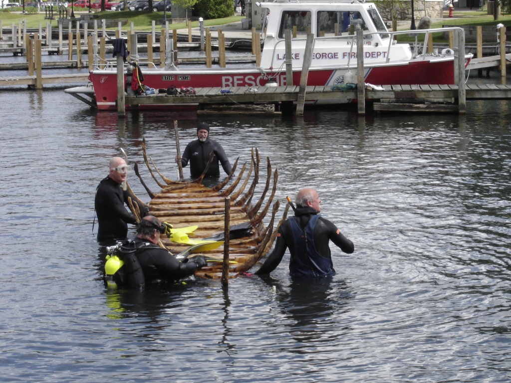 Volunteer divers prepare to sink an interpretive replica of a 1758 shipwreck in Lake George.  (Photo credit: Bob Benway)