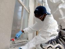 Zahaira Williams rehabilitating a window at the MSU Chapel