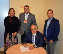 Hattie Mitchell, Prairie Band Potawatomi; Reno Franklin; Jordan Tannenbaum; and Ira Matt at signing ceremony.  