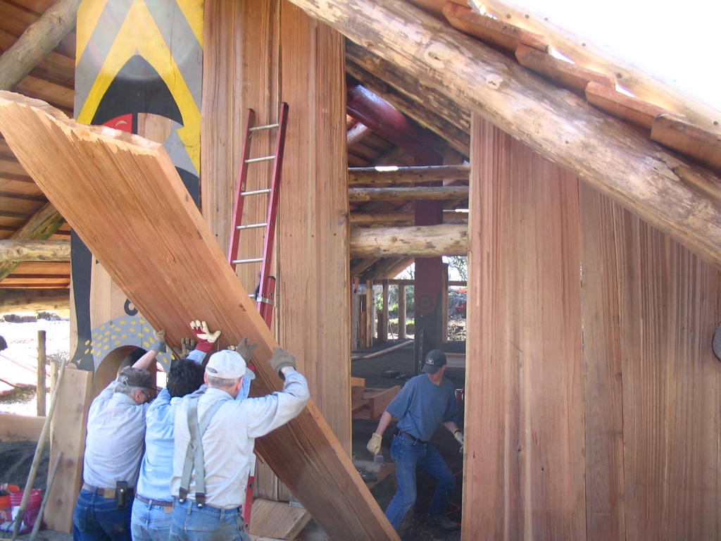 Erecting the plankhouse walls